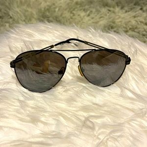 Black aviator sunglasses, dark tint